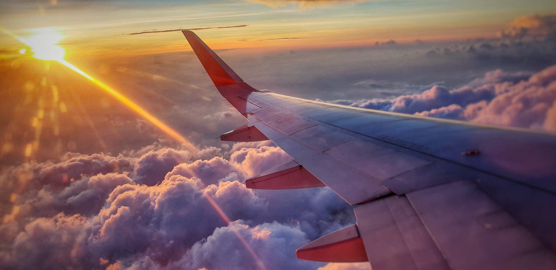 Airplane flying in the sun