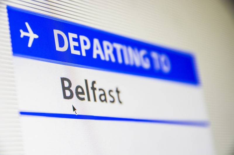Sign mentioning departure to Belfast Airport